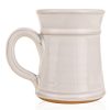 The back of the White Rabbit hand thrown mug. It is white colored.