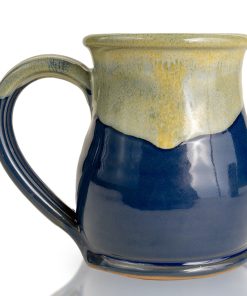 The back of the Lucy hand thrown mug. It is powder blue colored with a white and yellow glaze on top.