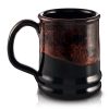 The back of the Bones Coffee Company Classic Logo mug that is black colored with an orange glaze on top of it.