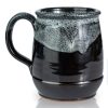 The back of the Dark Side Chocolate Truffle hand thrown mug. It is black colored with a white glaze on top.