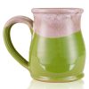 The back of the Bones Coffee Company Goofy Goober Sundae hand thrown mug. It is moss green colored and has a pink and white glaze on top of it.