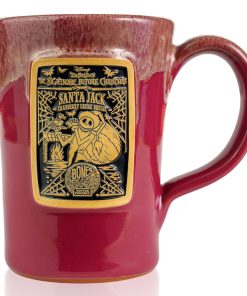 The front of the Bones Coffee Company Santa Jack hand thrown mug with Jack Skellington dressed as santa on the golden medallion. The mug is cranberry colored with a white glaze on top.