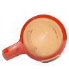 The bottom of the Twin Sun Tiramisu hand thrown mug. It is stamped with Lucasfilm and Deneen Pottery.