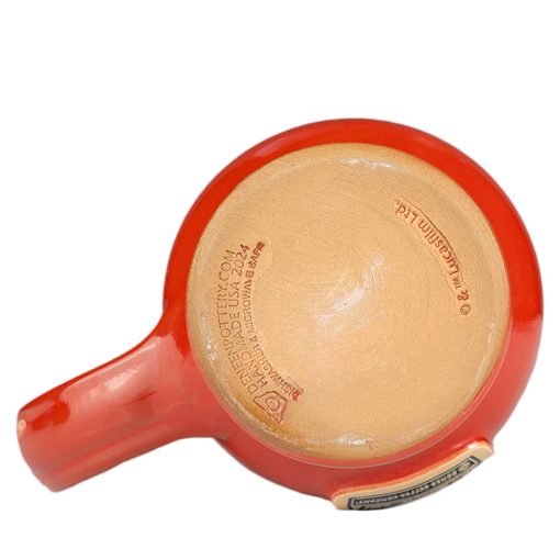 The bottom of the Twin Sun Tiramisu hand thrown mug. It is stamped with Lucasfilm and Deneen Pottery.