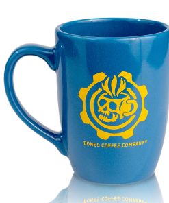 The back of the Vault Tech ceramic mug has a yellow Bones Coffee Company logo. The logo is of a skull that looks like a mug with steam coming out of it surrounded by a gear. The ceramic mug is colored blue.