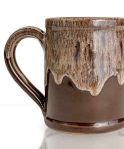 The back of the Ghoul hand thrown mug. It is chocolate colored with a sand white glaze on top.