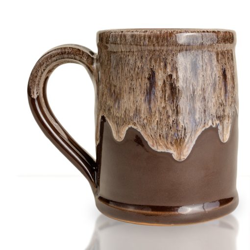 The back of the Ghoul hand thrown mug. It is chocolate colored with a sand white glaze on top.