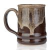 The back of the Wookiee Cookie hand thrown mug. It is chocolate colored with a sand-white glaze on top.