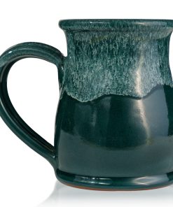 The back of the Frog’s Breath hand thrown mug. It is green colored with a white glaze on top.