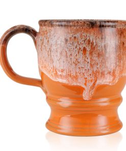 The back of the Jacked O’ Lantern hand thrown mug. It is orange colored with a pumpkin spice glaze on top.