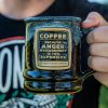 The Anger Management handthrown mug. It is being held up.