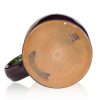 The bottom of the Mudslide Boogie hand thrown mug. It says Deneen Pottery on the tan bottom.