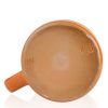 The bottom of the Pumpkin King hand thrown mug. It says Deneen Pottery on the tan bottom.