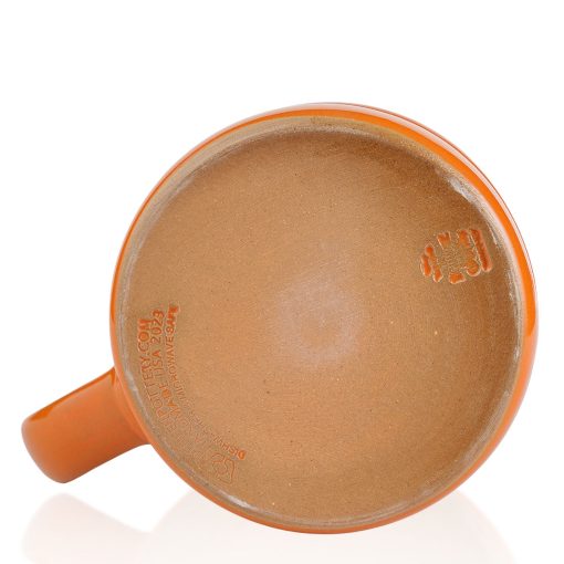 The bottom of the Pumpkin King hand thrown mug. It says Deneen Pottery on the tan bottom.