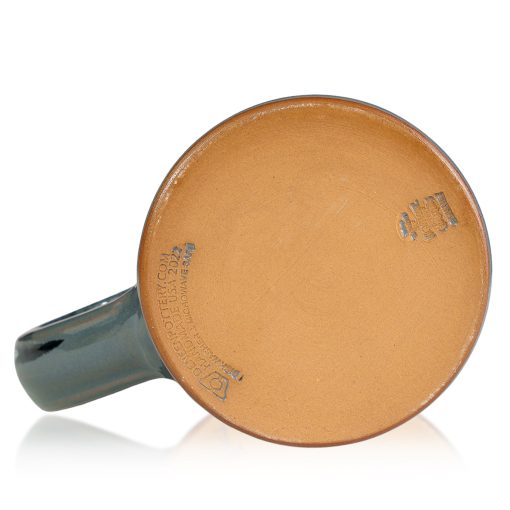 The bottom of the Ruff Weather hand thrown mug. It says Deneen Pottery on the tan bottom.